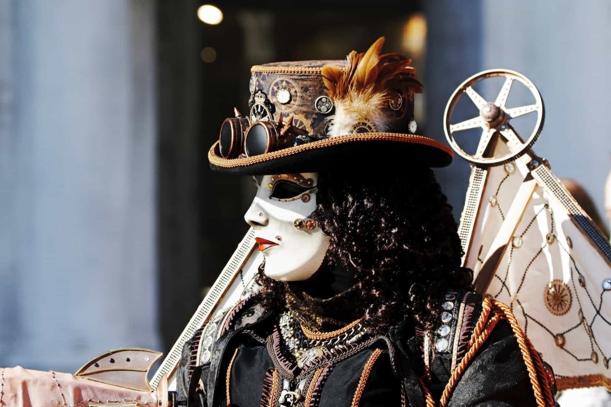 a person in a mask and steampunk outfit